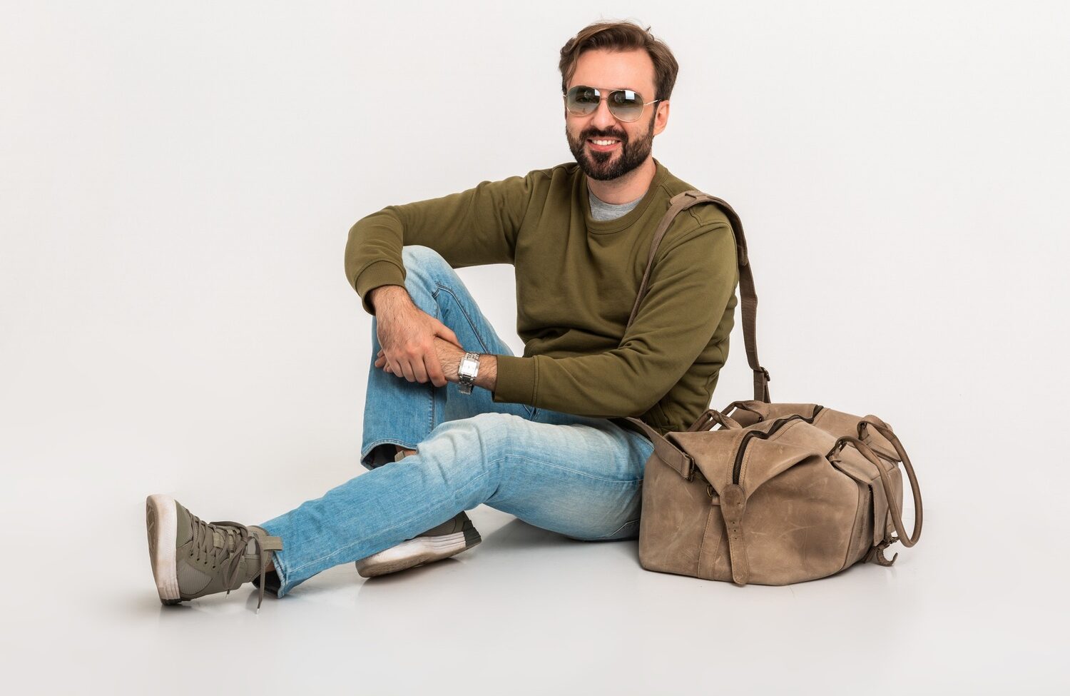 hansome bearded stylish man sitting on floor u8c62kr