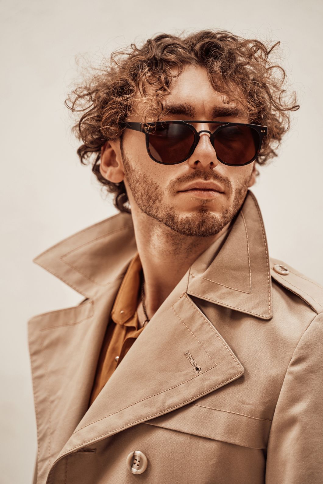 portrait of a handsome casual guy with curly hair rble9q5.jpg